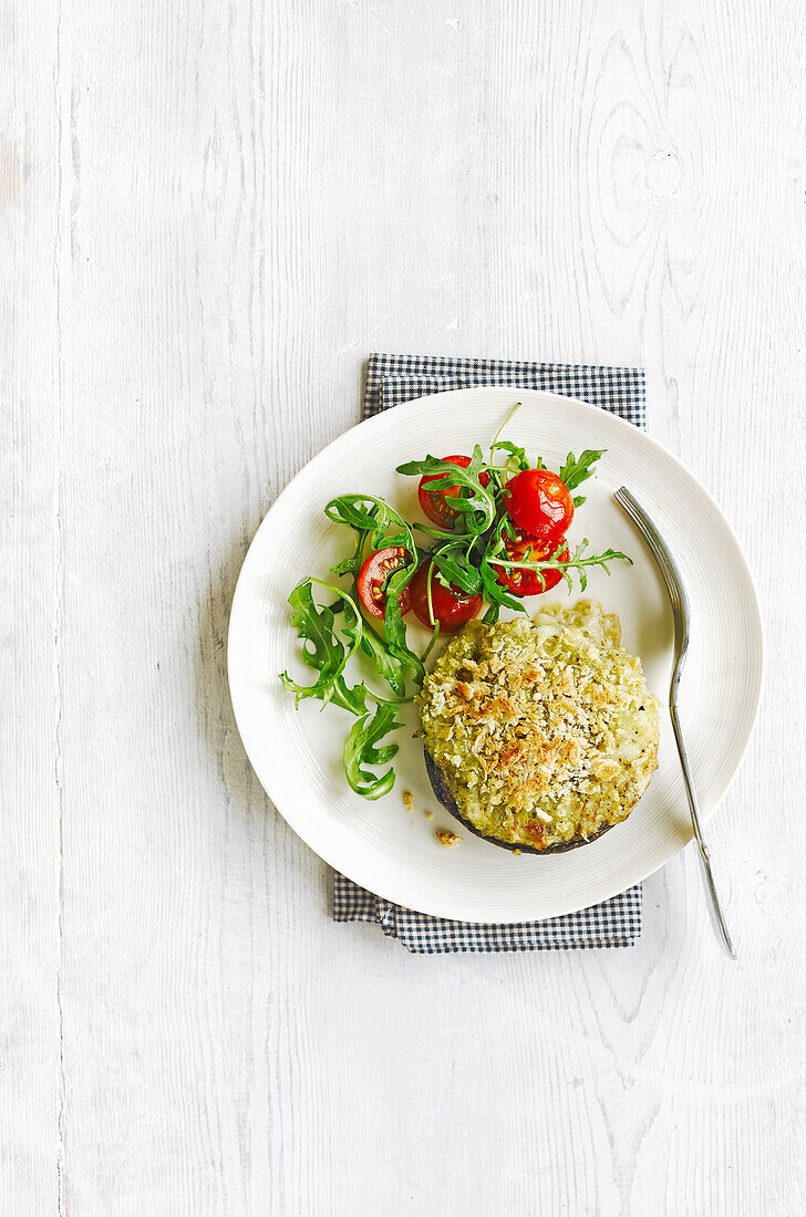 Baked mushroom with pesto and mozzarella cheese