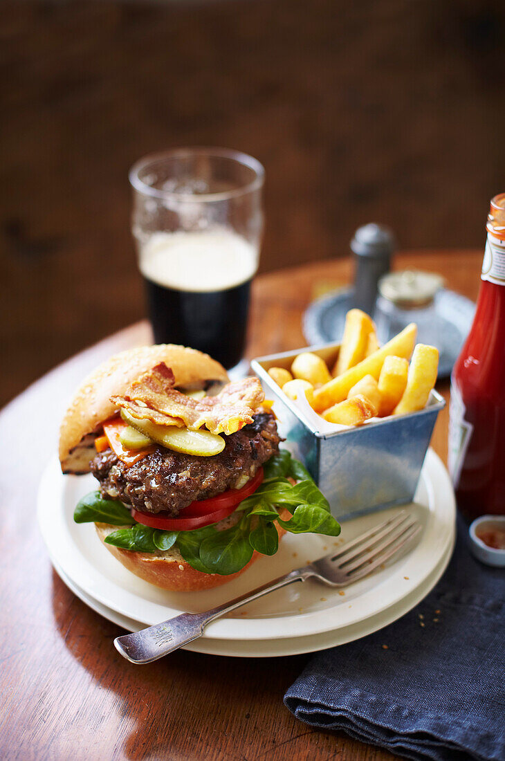 Burger with bacon, served with french fries