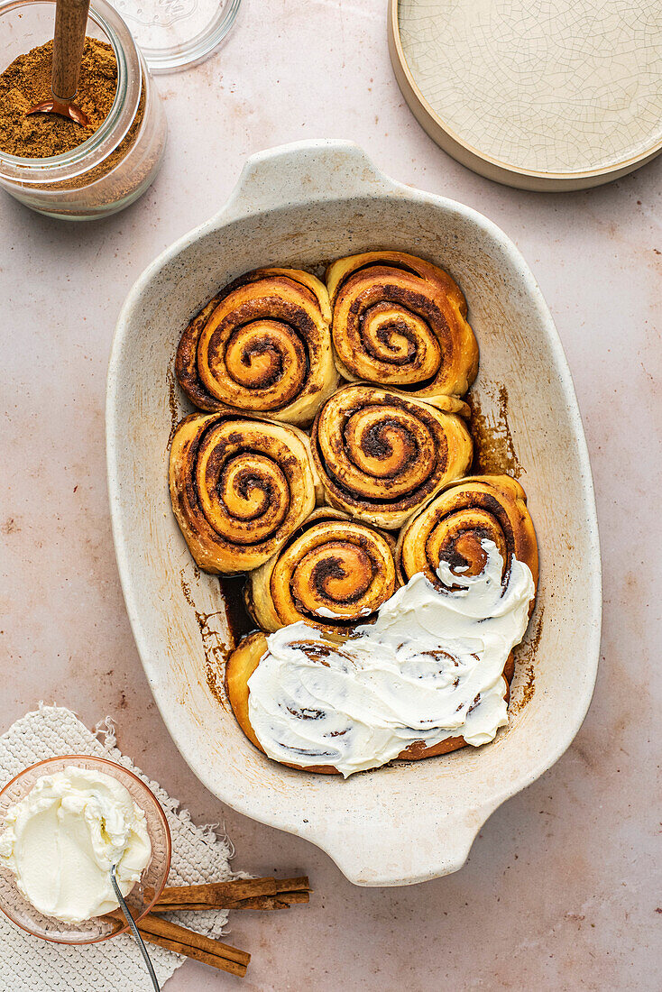 Homemade Cinnamon rolls against a pink background