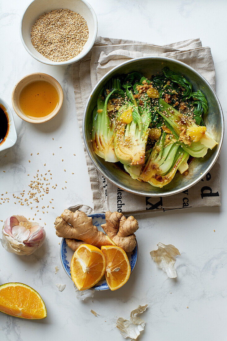Braised bok choy cabbage with ginger, soy sauce and red orange juice