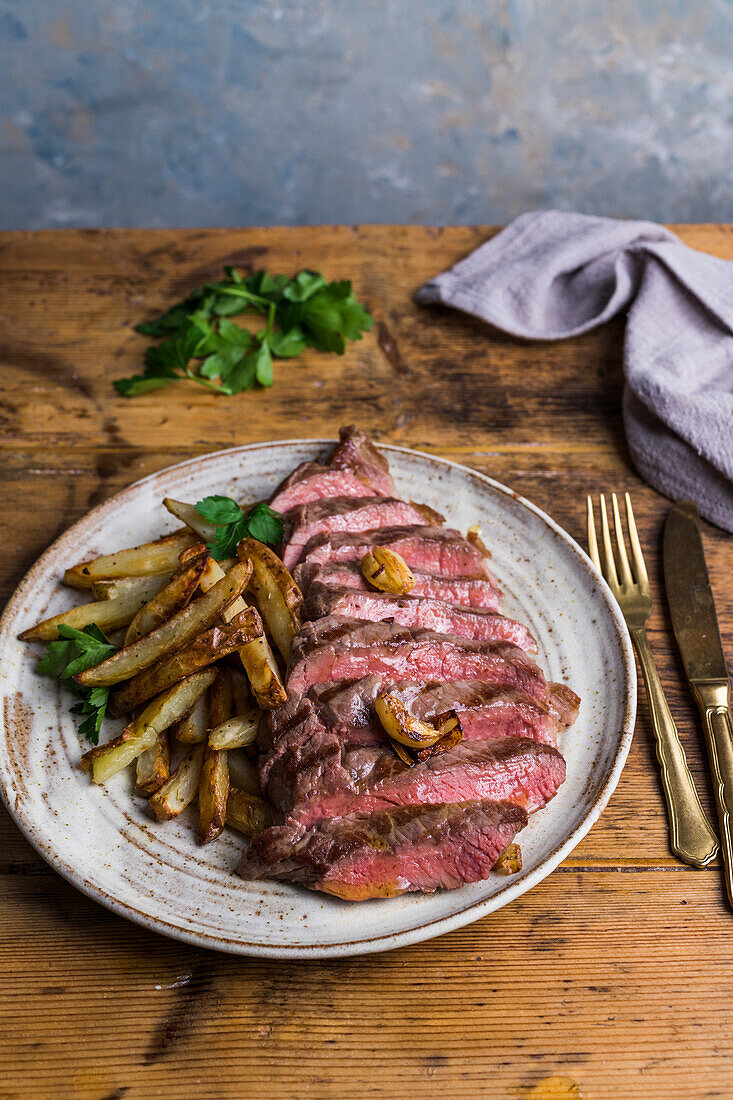 Homemade steak and chips on a plate