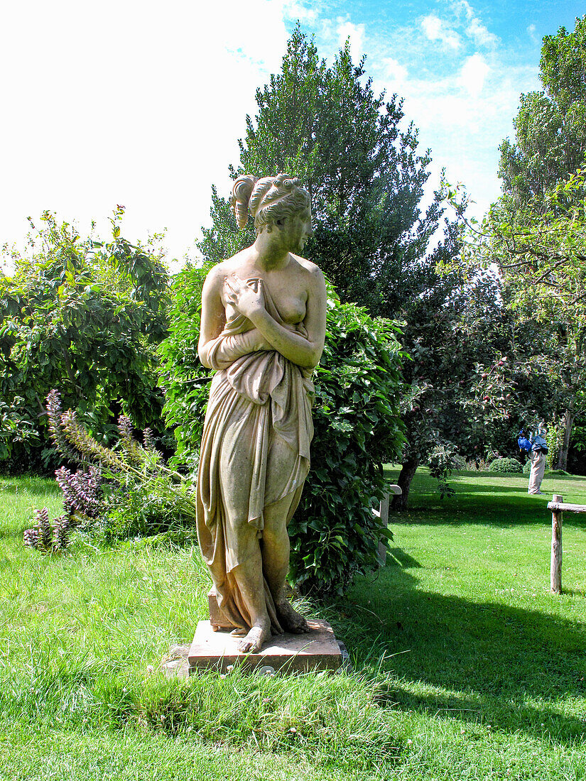 Stone statue of Pandora in a park