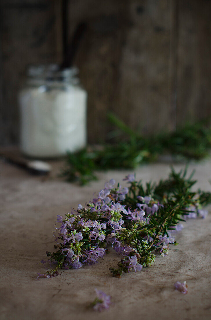 Fresh rosemary on a wooden kitchen table