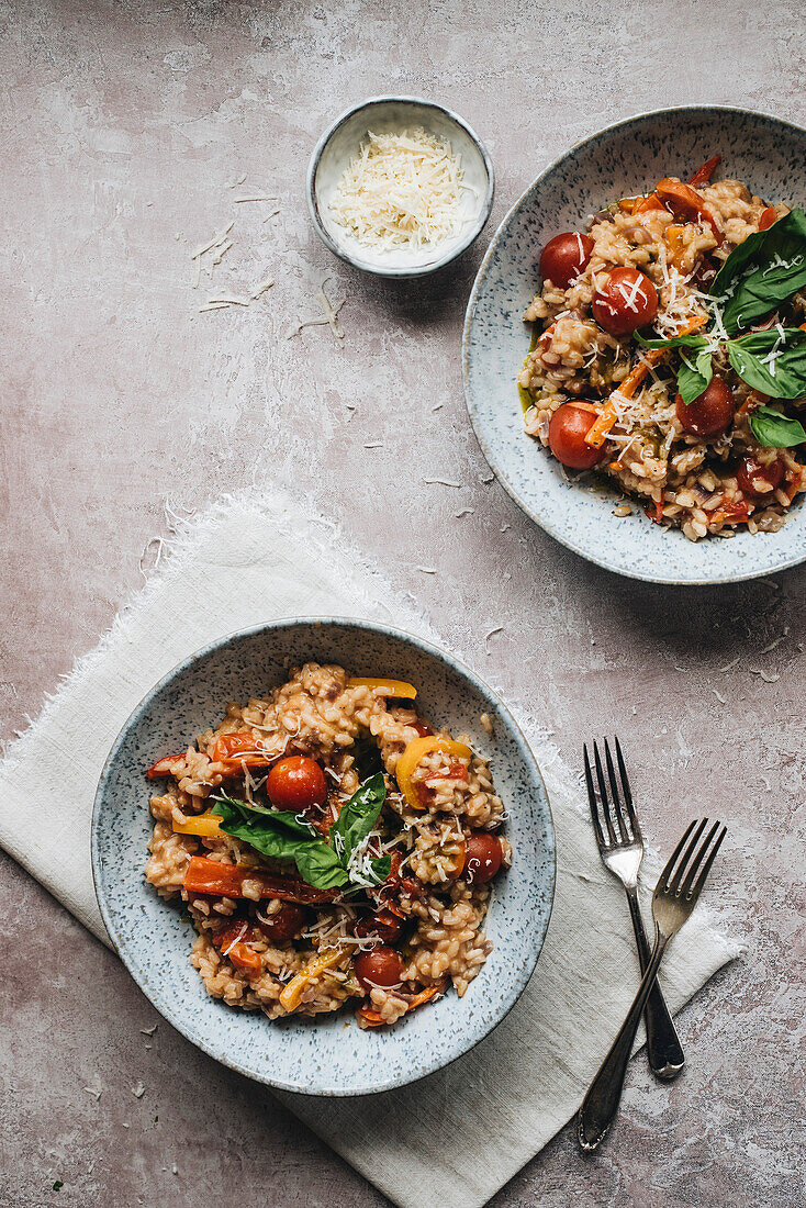 Italian Risotto With Cherry Tomatoes, Peppers And Fresh Basil