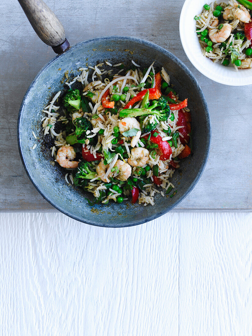 Rice pan with prawns, broccoli, peppers, and peas