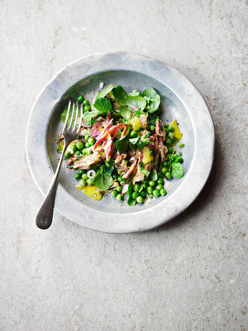 Pea salad with pork shank and watercress