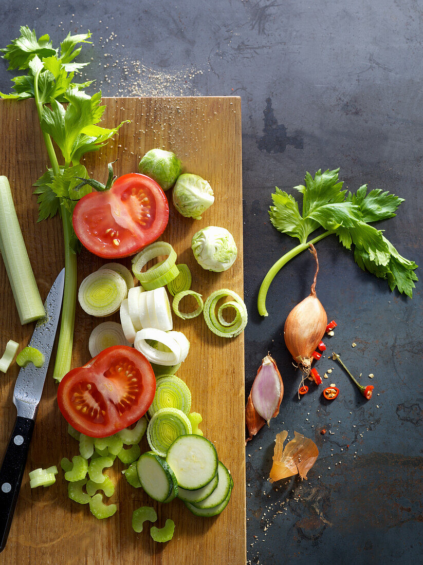 Sliced vegetables on a wooden board