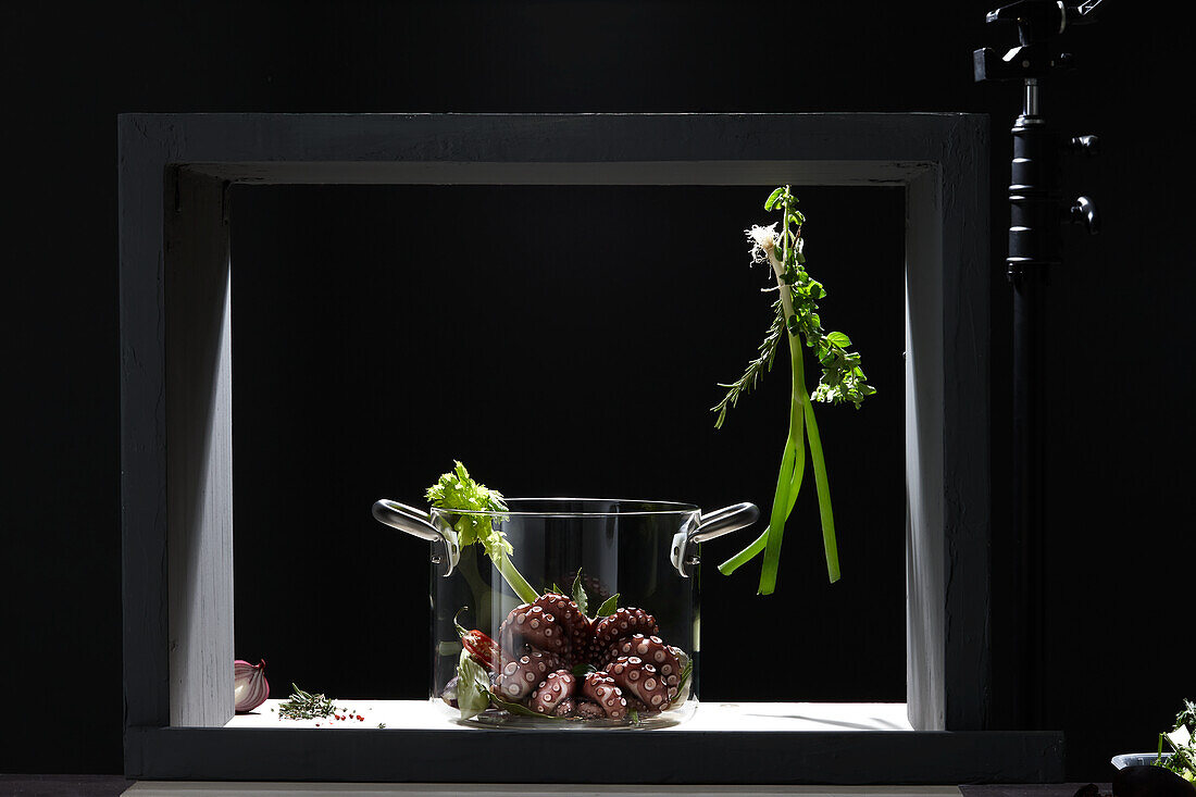 Octopus with vegetables in a glass jar