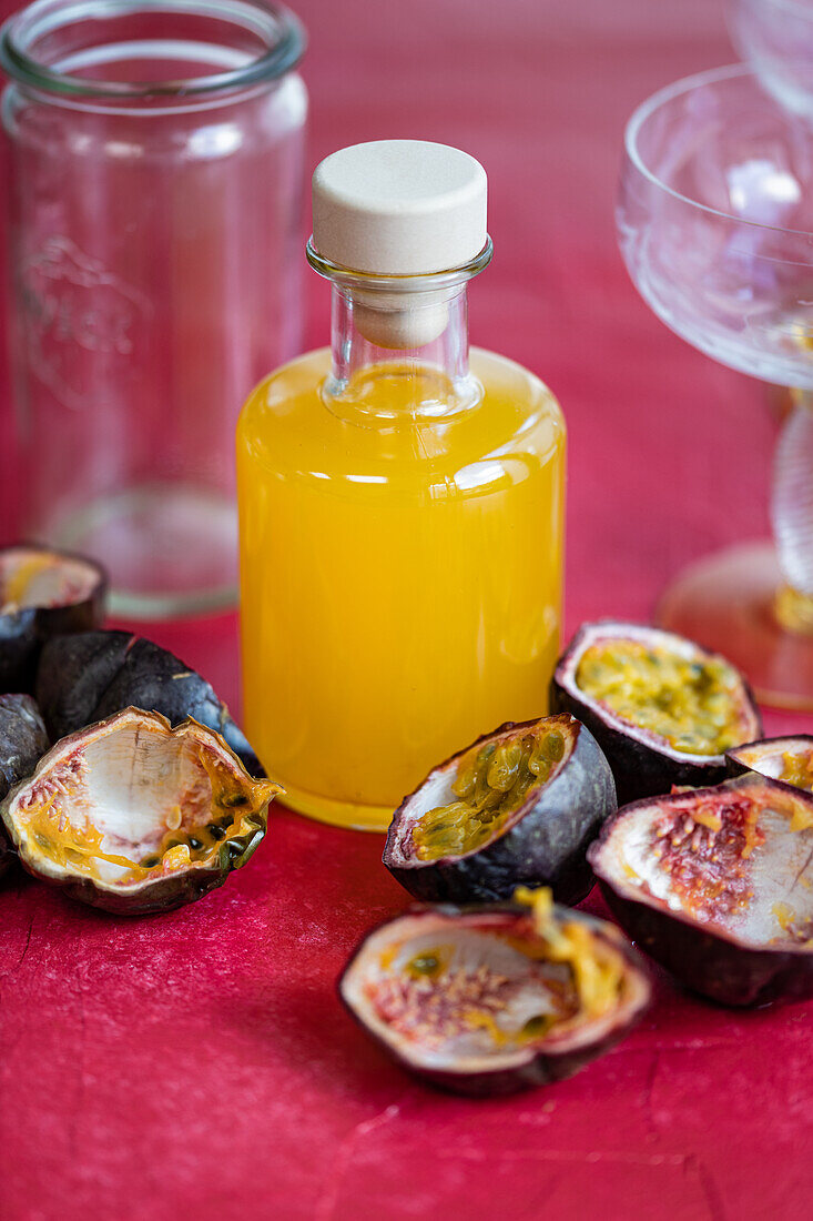 Passion fruit and passion fruit juice in glass bottle