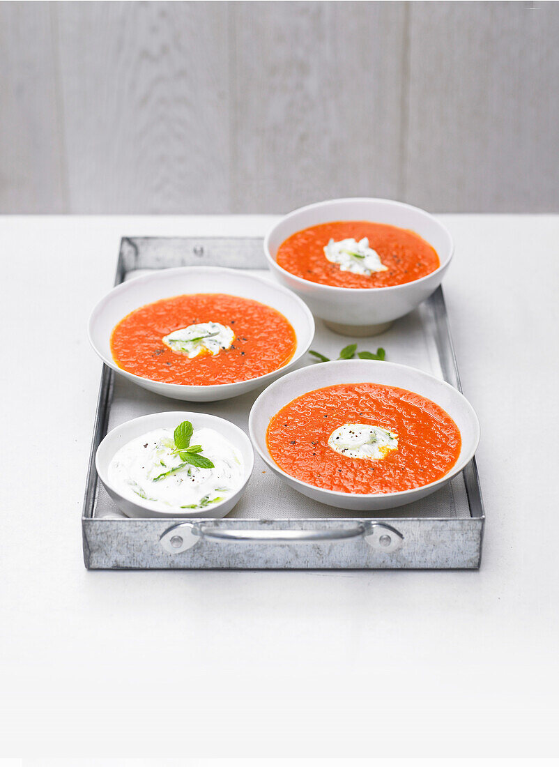Spicy pepper and tomato soup with cucumber yogurt