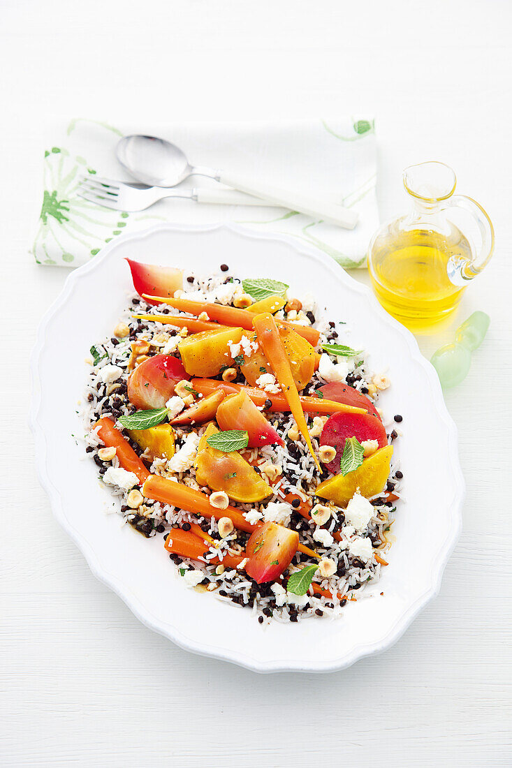 Lentil and rice salad with beets, carrots, and feta dressing
