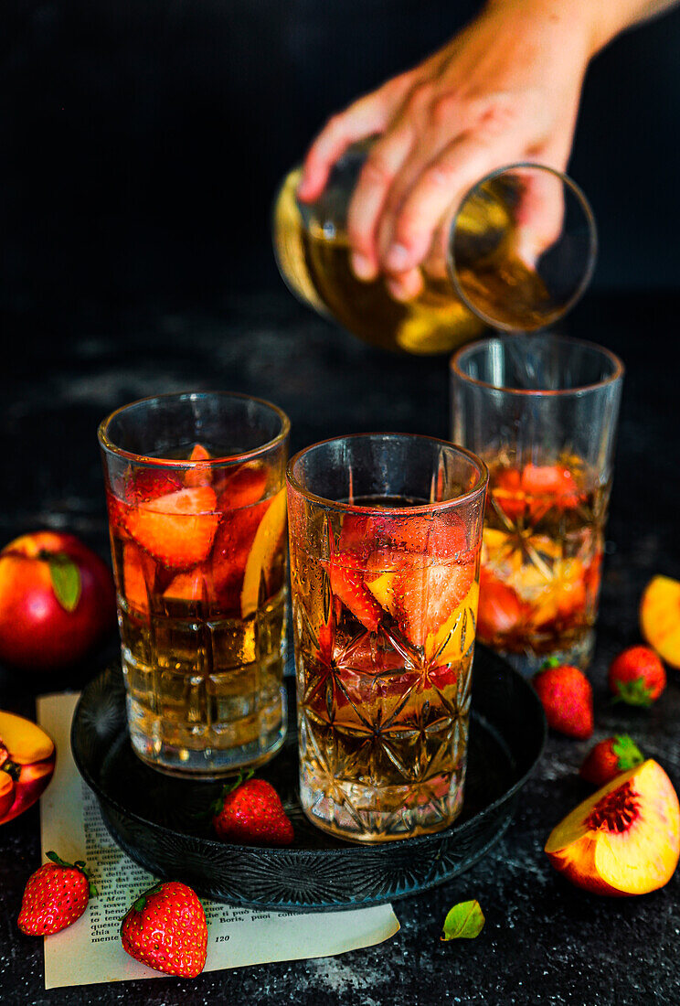 Iced tea with fruit and thyme