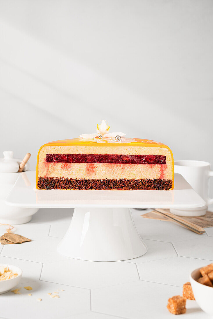 Caramel mousse cake with cherry compote and chocolate sponge cake