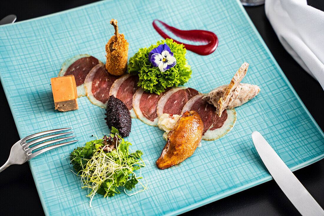 Duck breast and duck liver on a serving platter