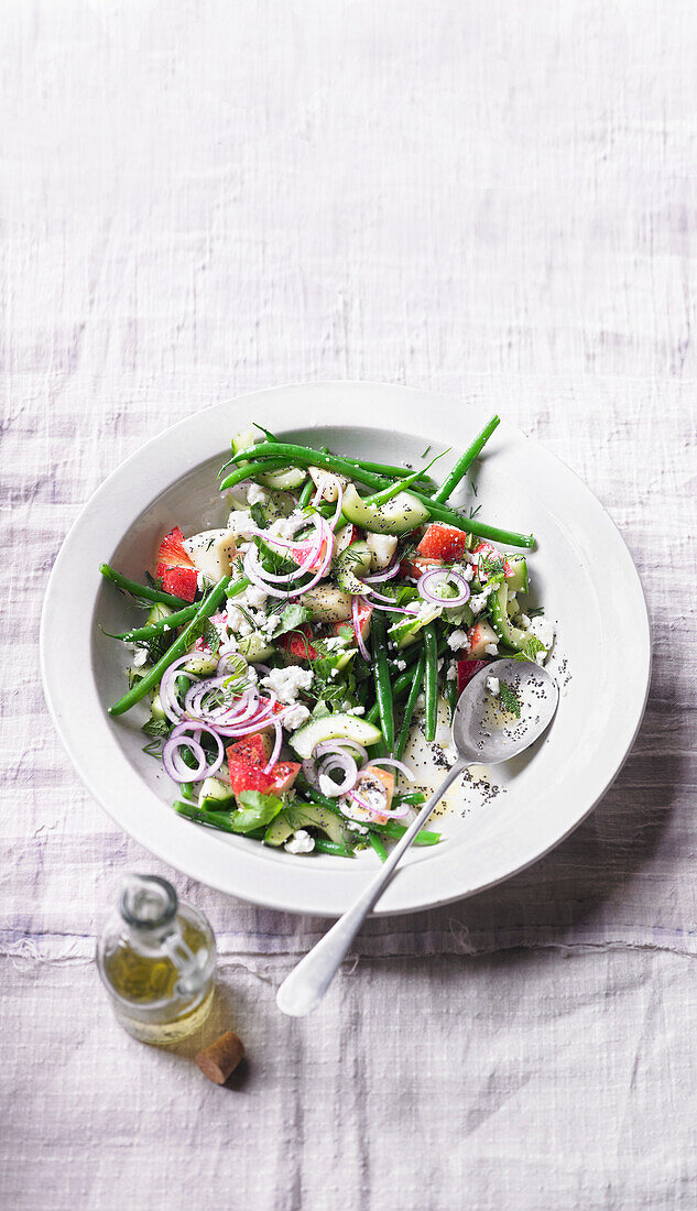 Vegetable salad with herb feta, nectarines, and lemon poppy seed dressing