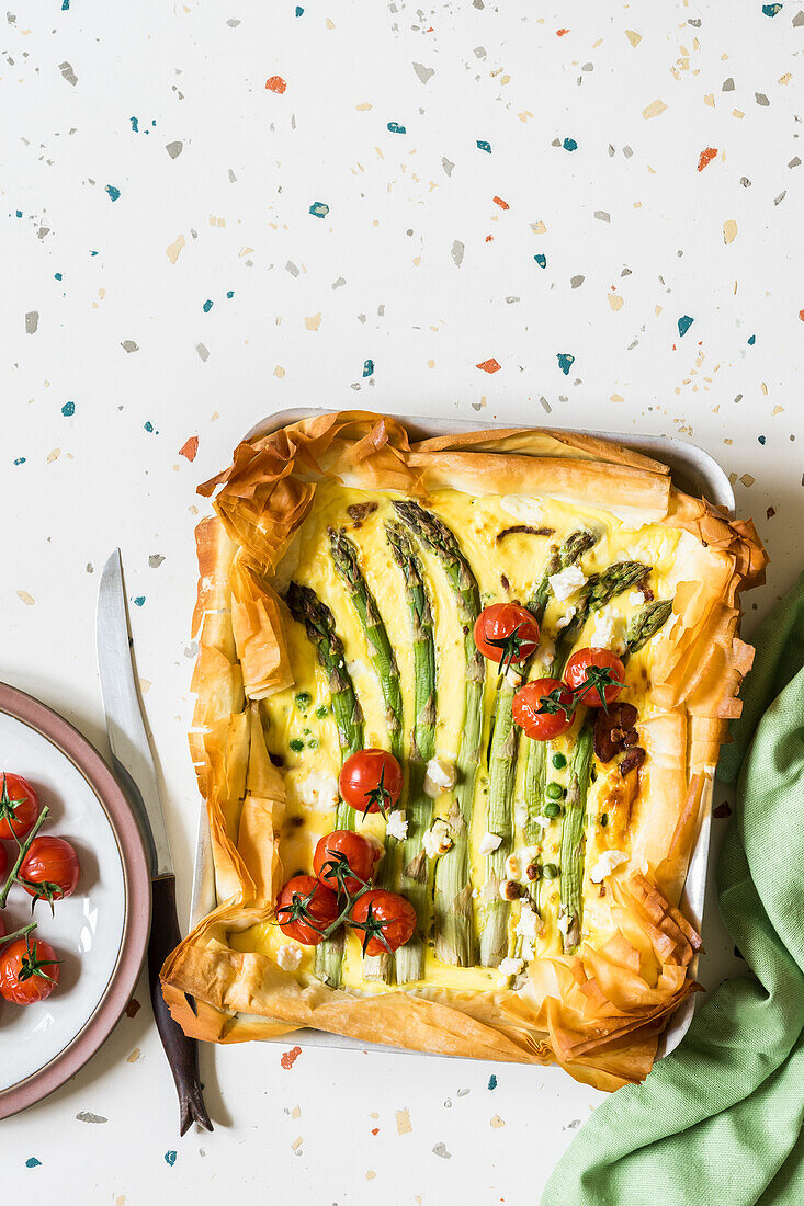 Phyllo dough tart with asparagus, green peas, bacon and feta