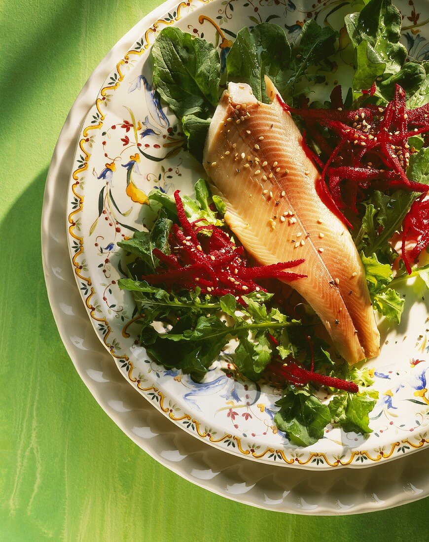 Smoked salmon trout on rocket and beetroot salad