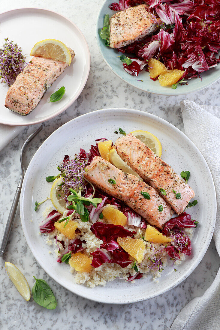 Baked salmon with millet, radicchio, oranges, and sprouts