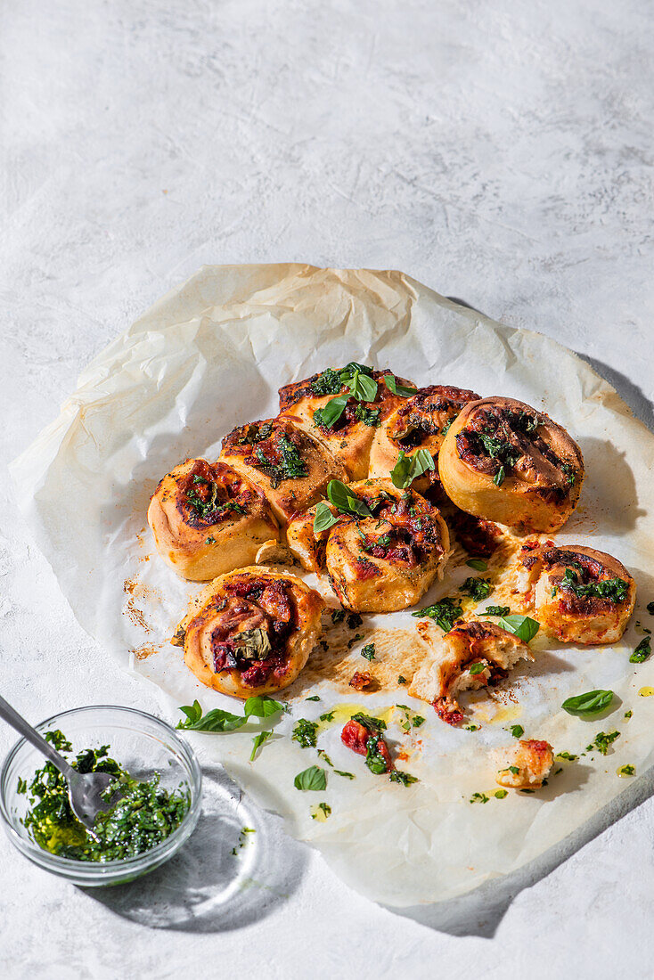 Stromboli rolls filled with pesto, tomato and mozarella cheese