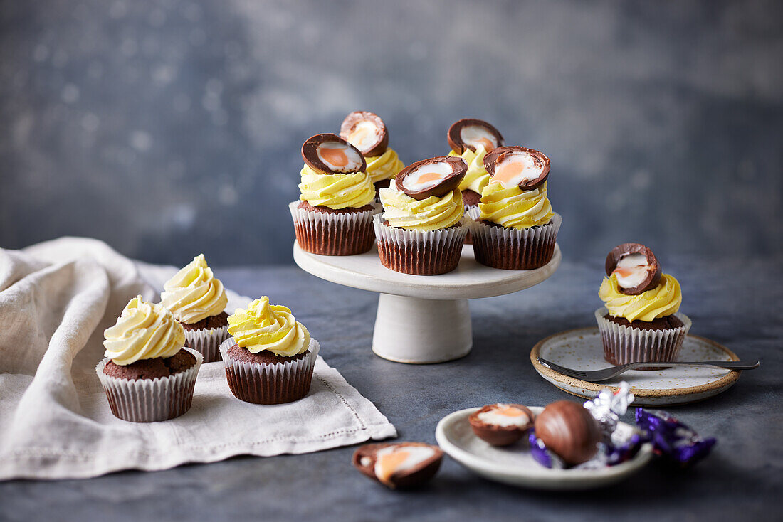 Easter cupcakes with cream topping and filled chocolate eggs