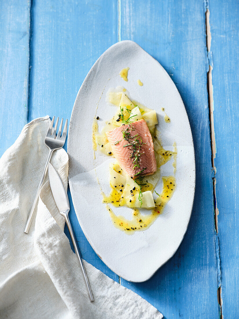 Sous-vide cooked char on kohlrabi carpaccio with passion fruit dressing