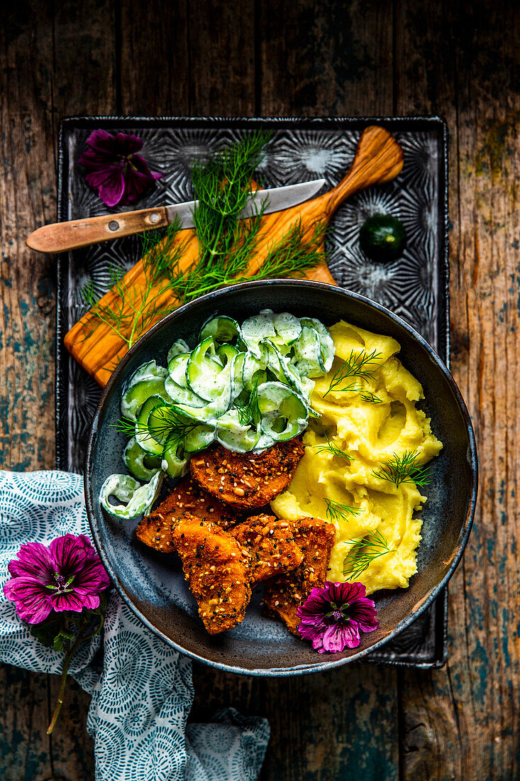 Butternut squash in a grain crust with cucumber salad and puree