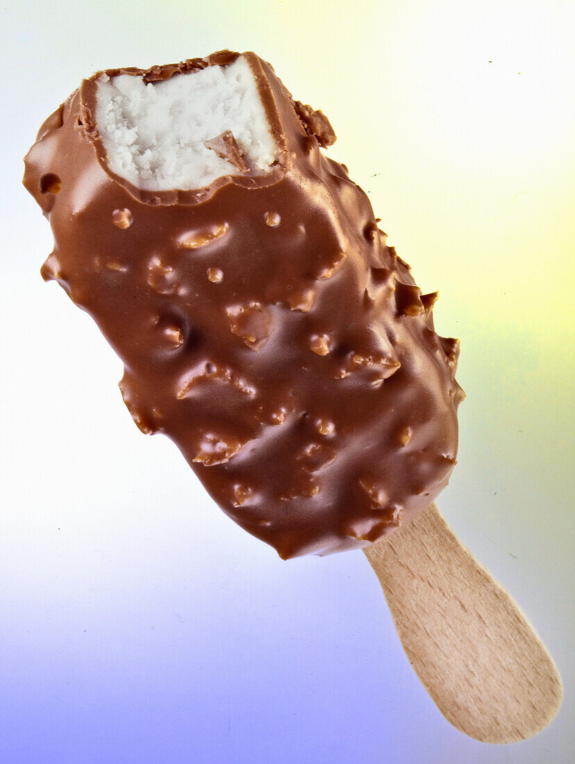 Coconut ice cream with chocolate glaze served on a Popsicle stick