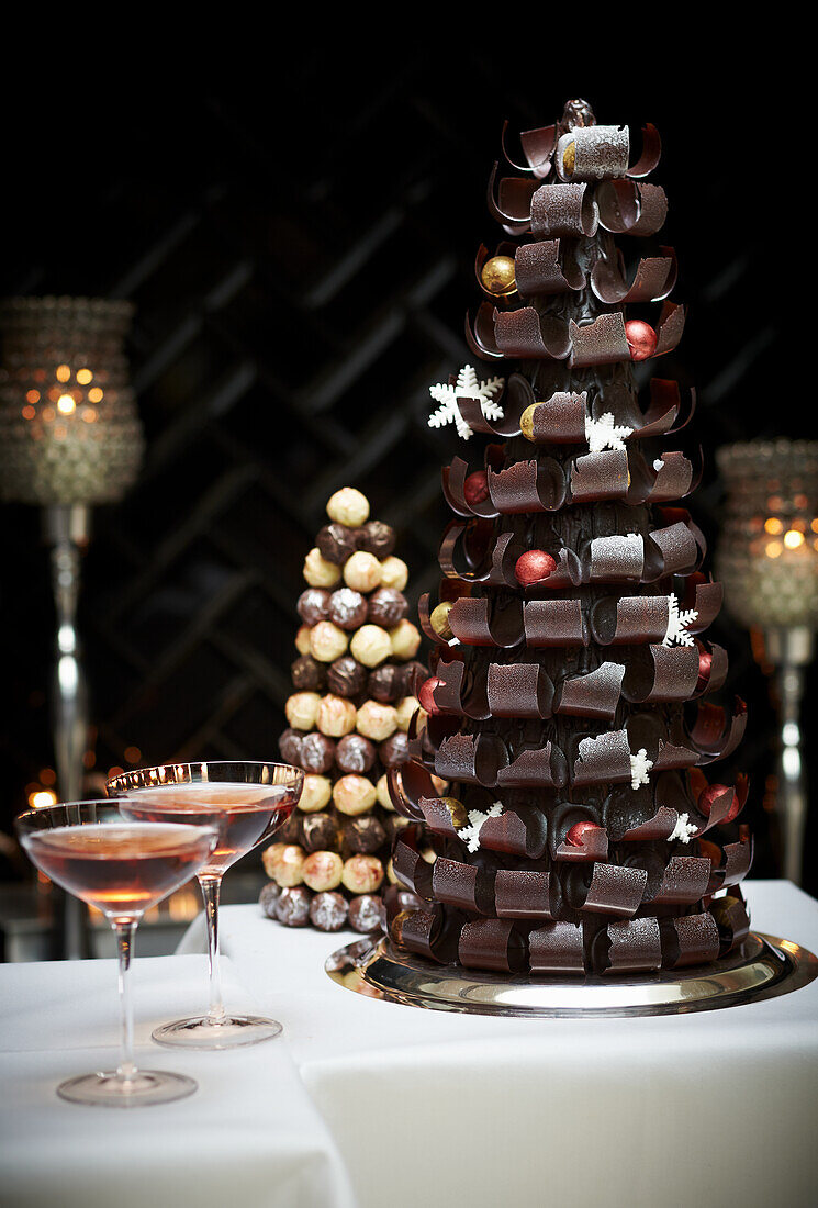 Curled chocolate Christmas centrepiece, pink champange, a trio of chocolate, caramel and vanilla truffles formed into a tower