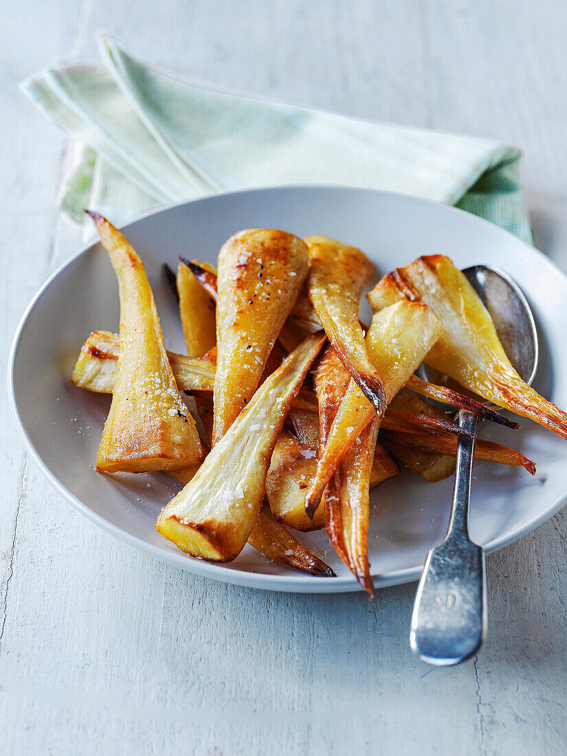 Roasted parsnips in serving bowl