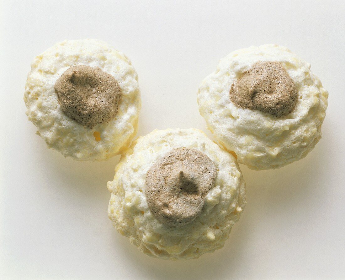 Three white chocolate macaroons with coconut