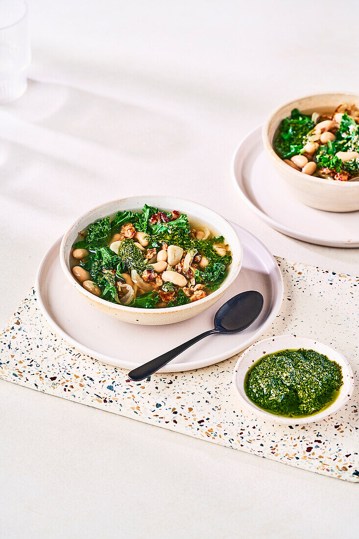 Soup with turkey sausage, vegetables, and pesto