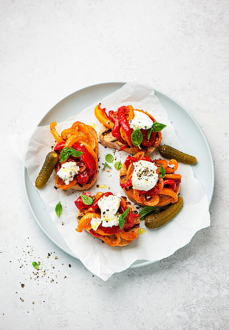 Crostini with colorful peppers and pickles