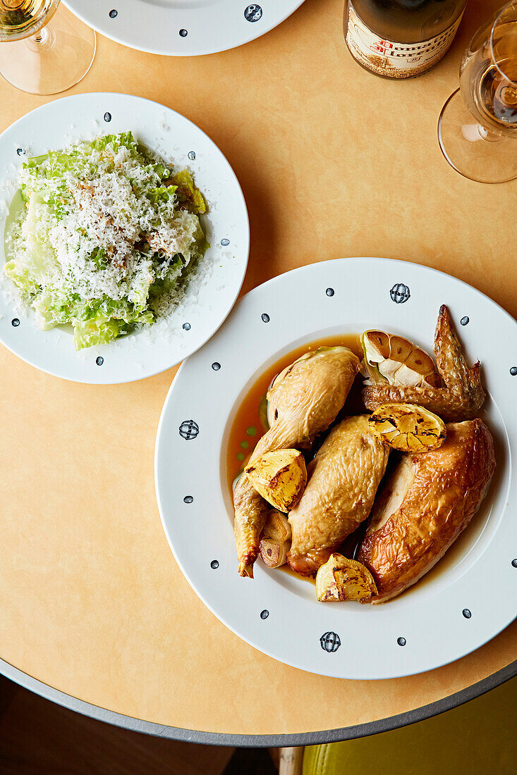 Boiled chicken served with romaine lettuce with parmesan cheese