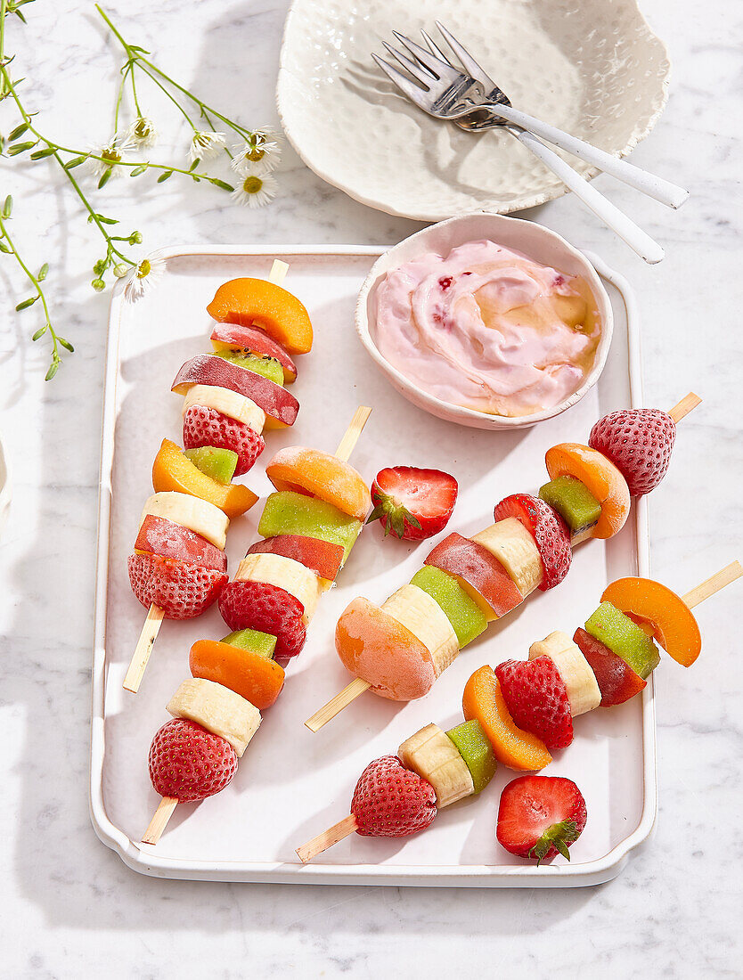 Frozen fruit skewers with strawberry dip