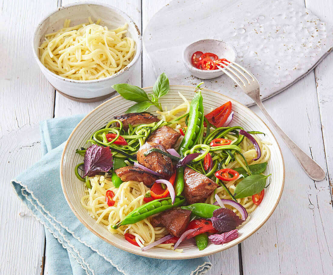 Marinated pork with noodles and vegetable