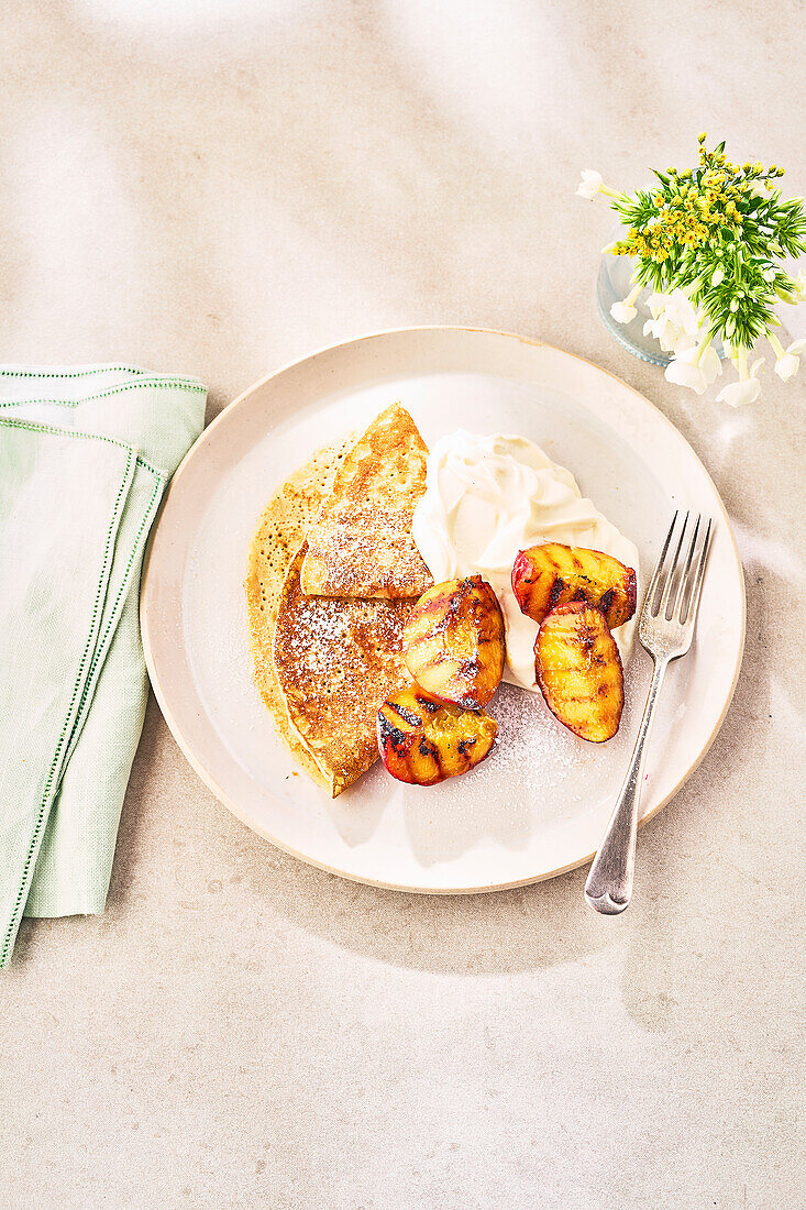 Grilled peach with pancakes and ricotta cheese