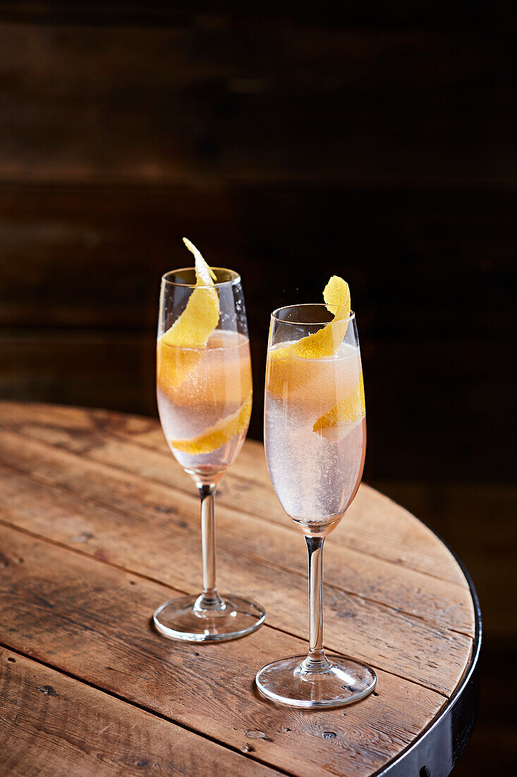 Cocktail with Prosecco on a wooden table