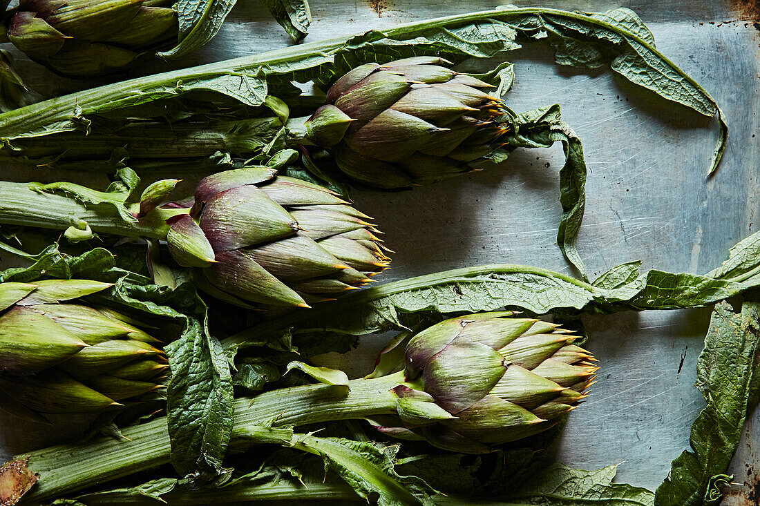 Fresh artichokes with leaves