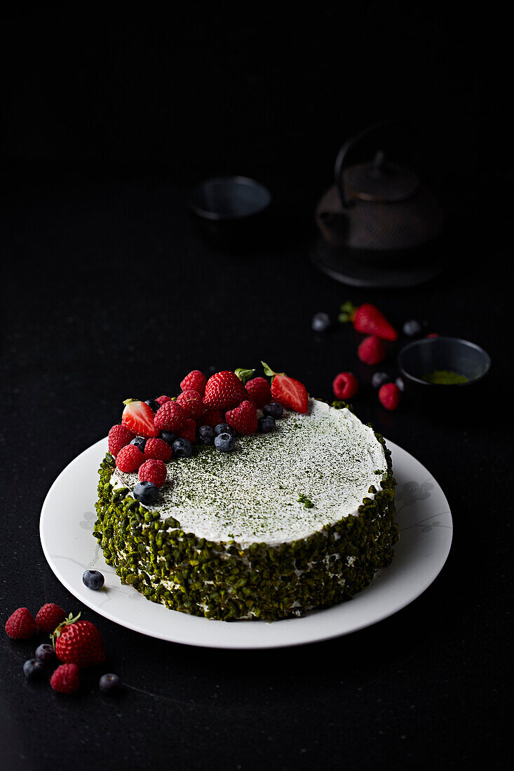 Matcha mille-feuille cake with pistachios and summer berries