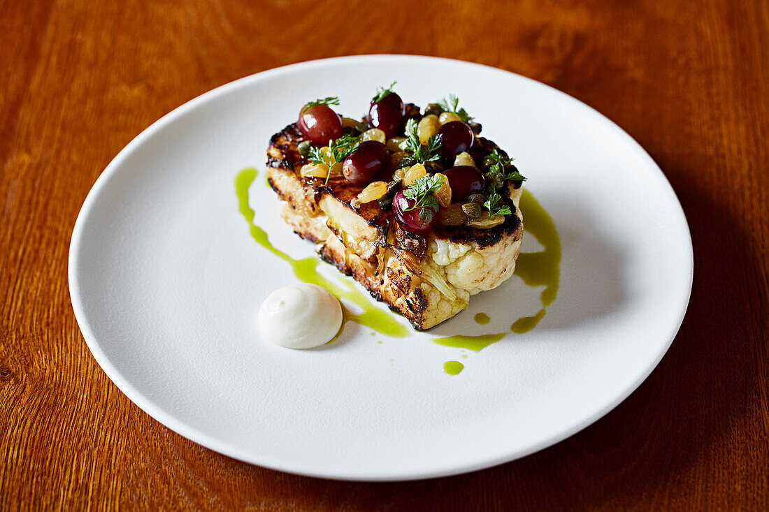 Cauliflower steak with grapes