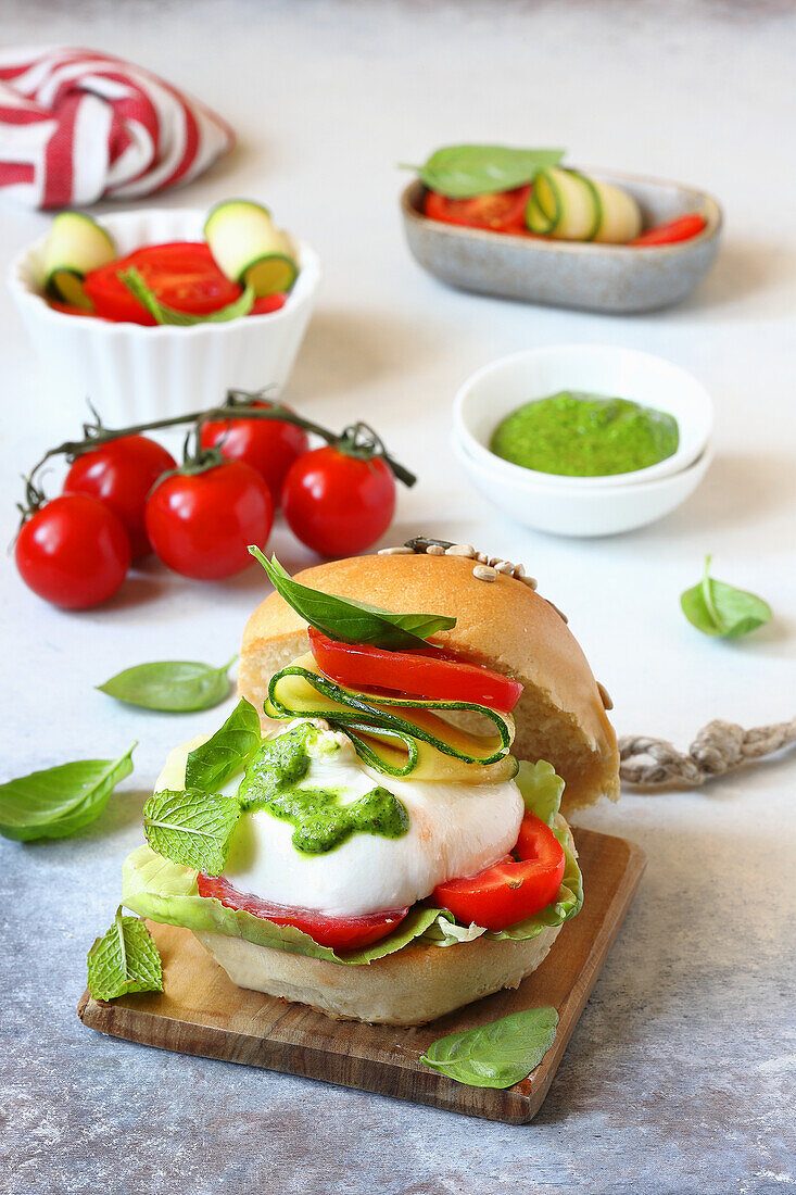 Burger buns with burratina tomatoes and basil pesto
