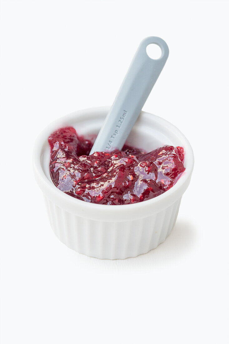 Raspberry jam in a small bowl