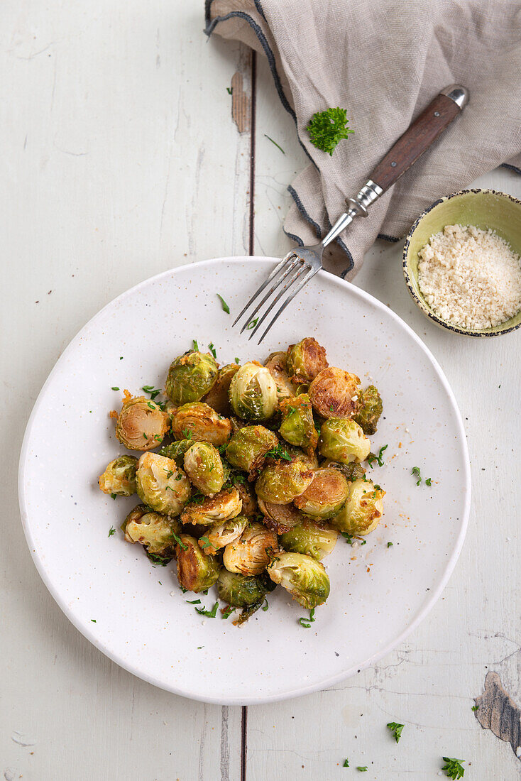 Oven baked Brussels sprouts with vegan parmesan substitute