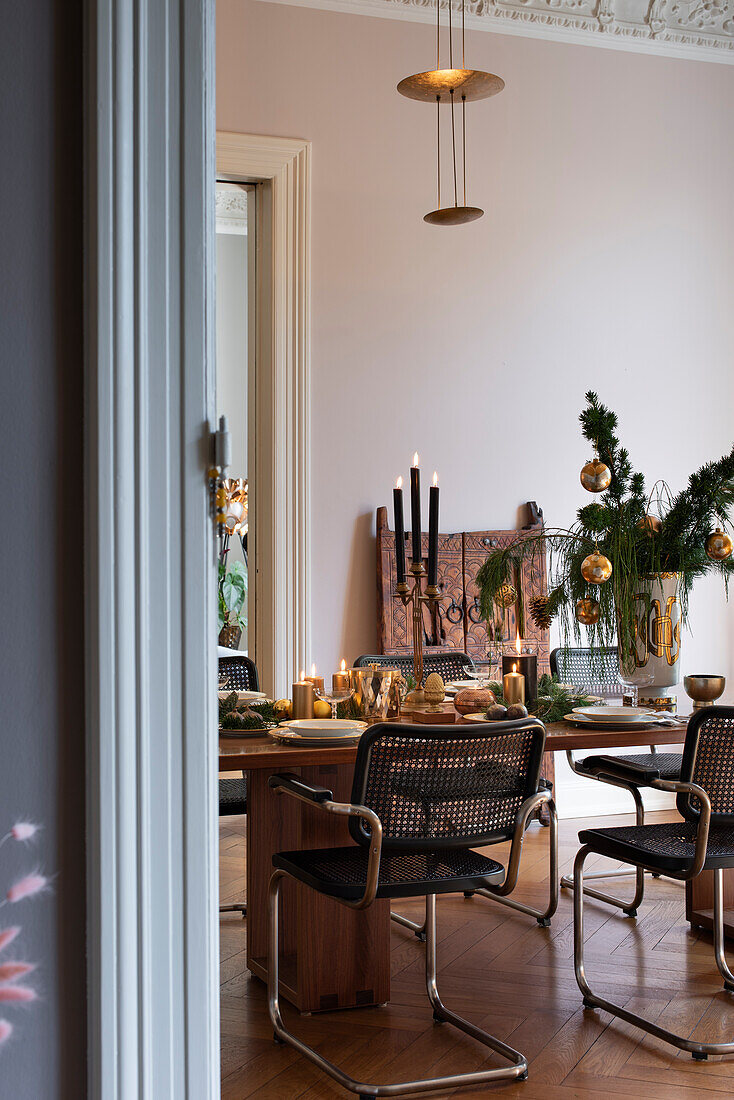 Festively laid Christmas table with cantilever chairs