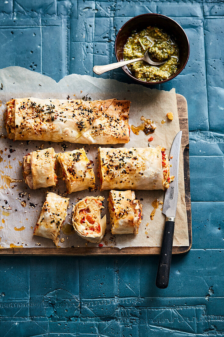 Filo pastry rolls filled with jalapeños, feta, spring onions and artichokes