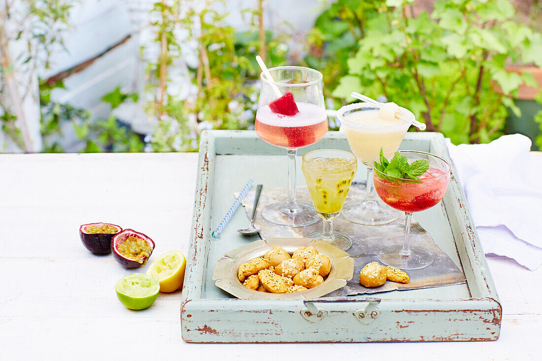 Summer cocktails on a wooden tray
