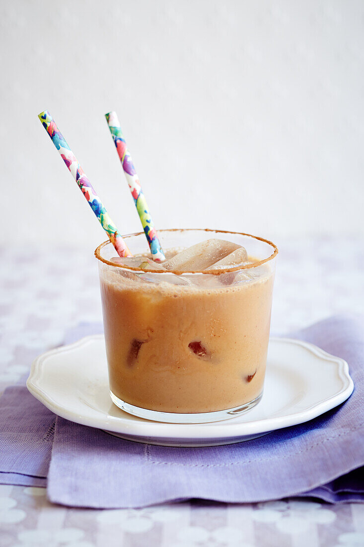 Vegan soy milk iced coffee with straws