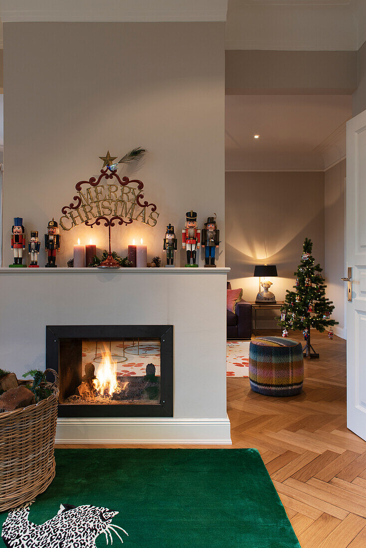 Fireplace with fire, collection of nuts on the mantelpiece