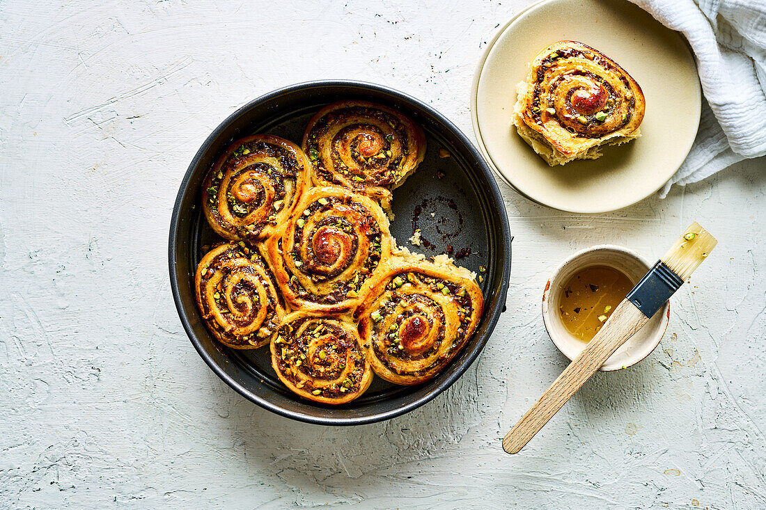 Yeast buns with cinnamon, dates, honey, and pistachios