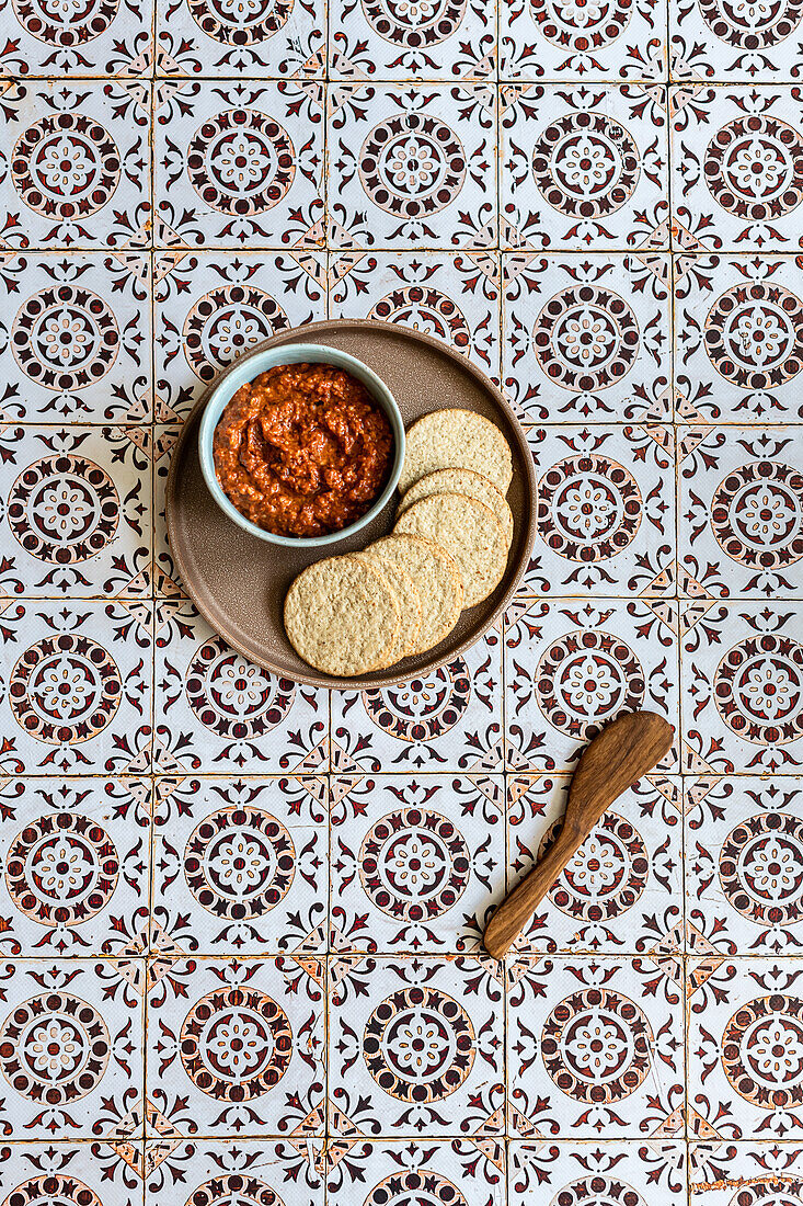 Muhammara - a spicy dip made of walnuts, red bell peppers, pomegranate molasses, and breadcrumbs. It originated in Aleppo, Syria.